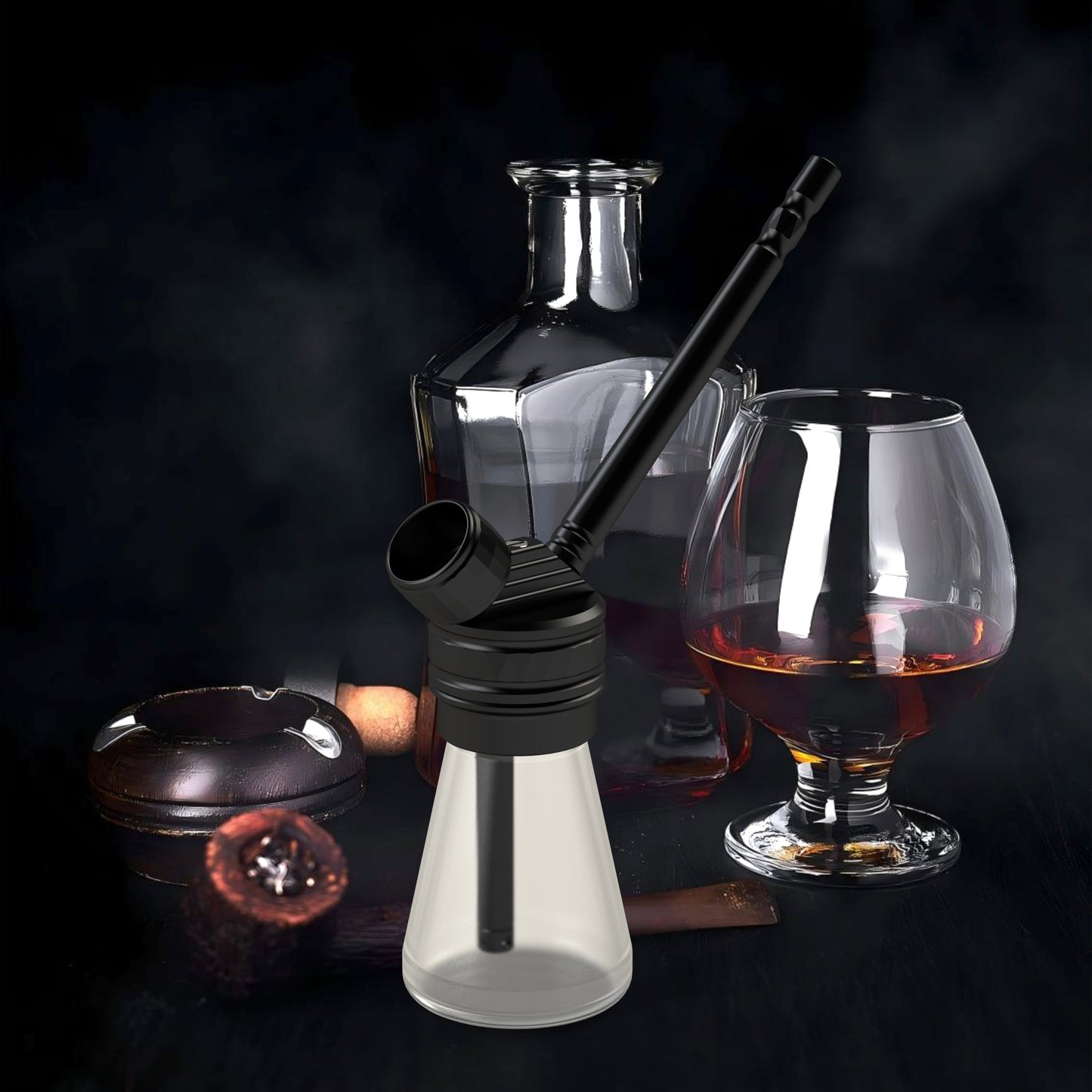 Alcohol decanter with smoking apparatus and glass on a dark background